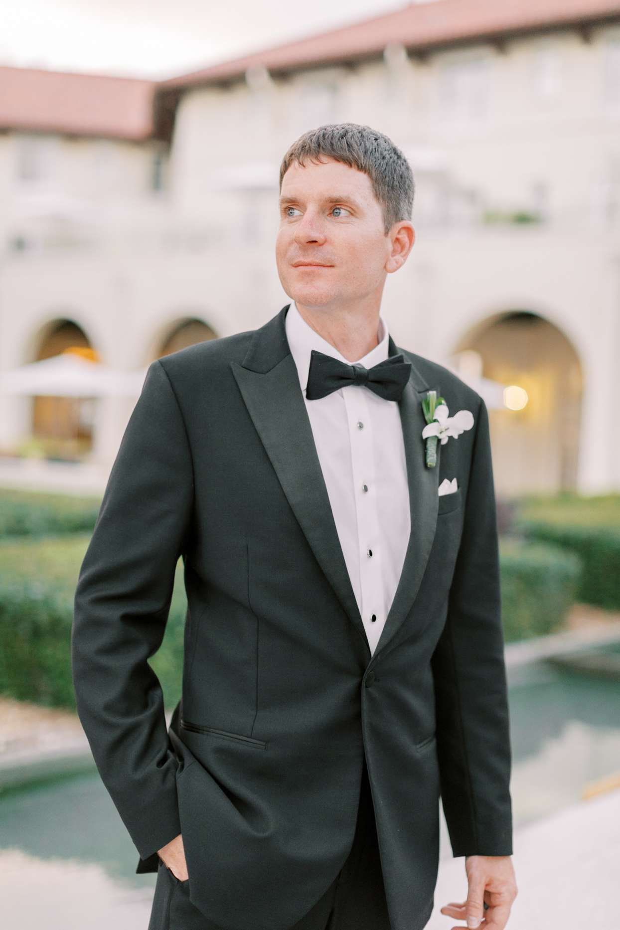 groom in black wedding tux
