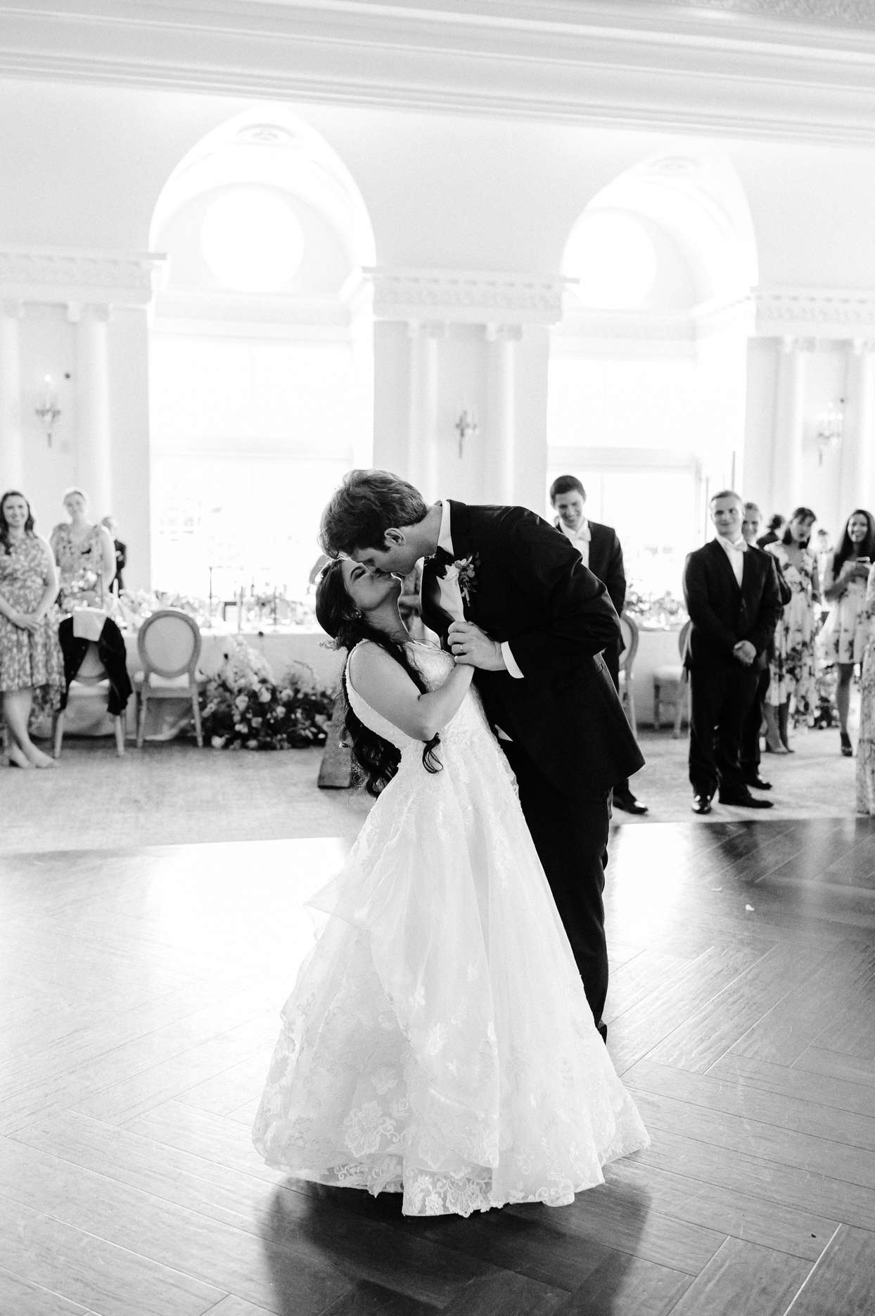 bride and groom kissing during dance