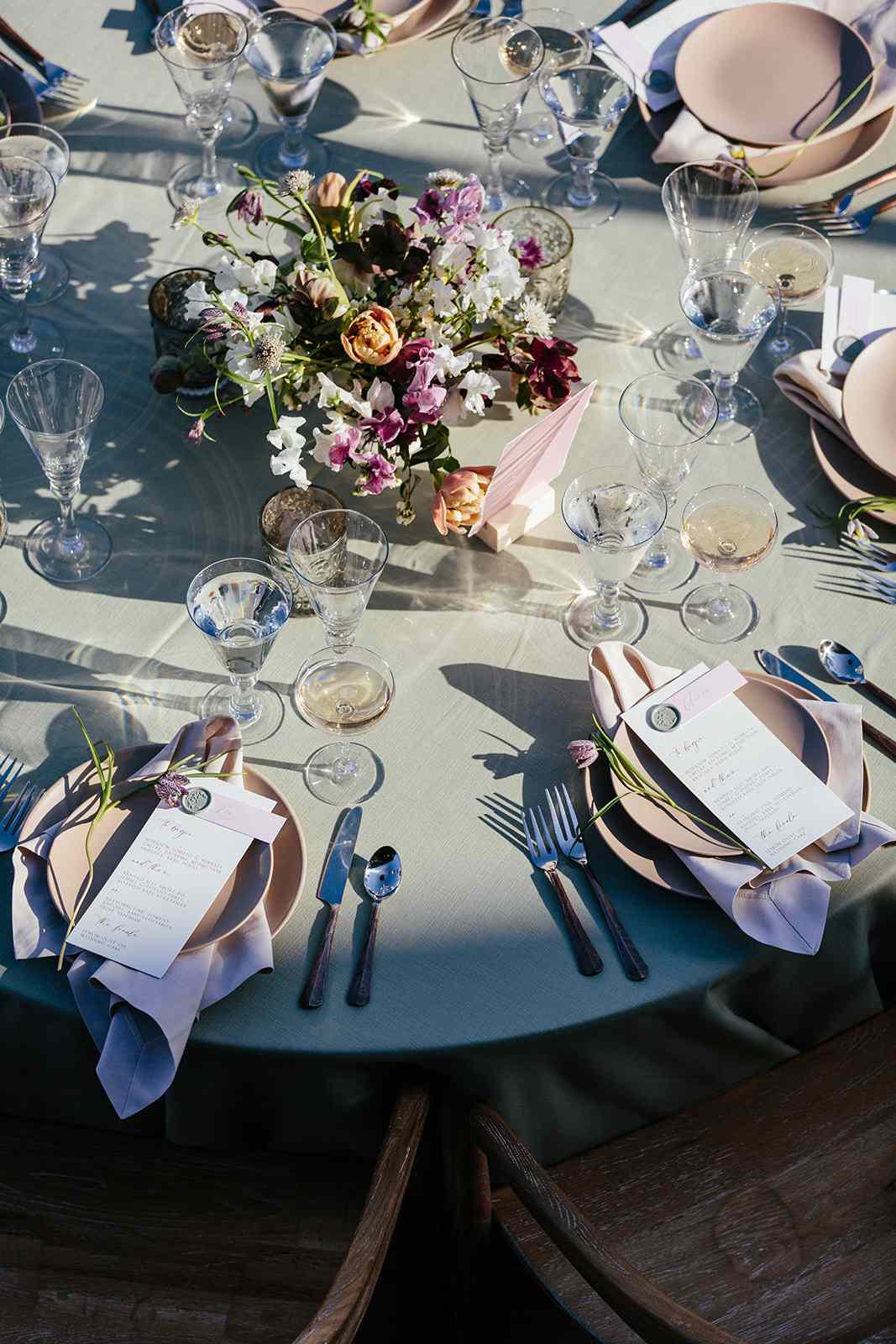 purple and neutral hued reception place settings