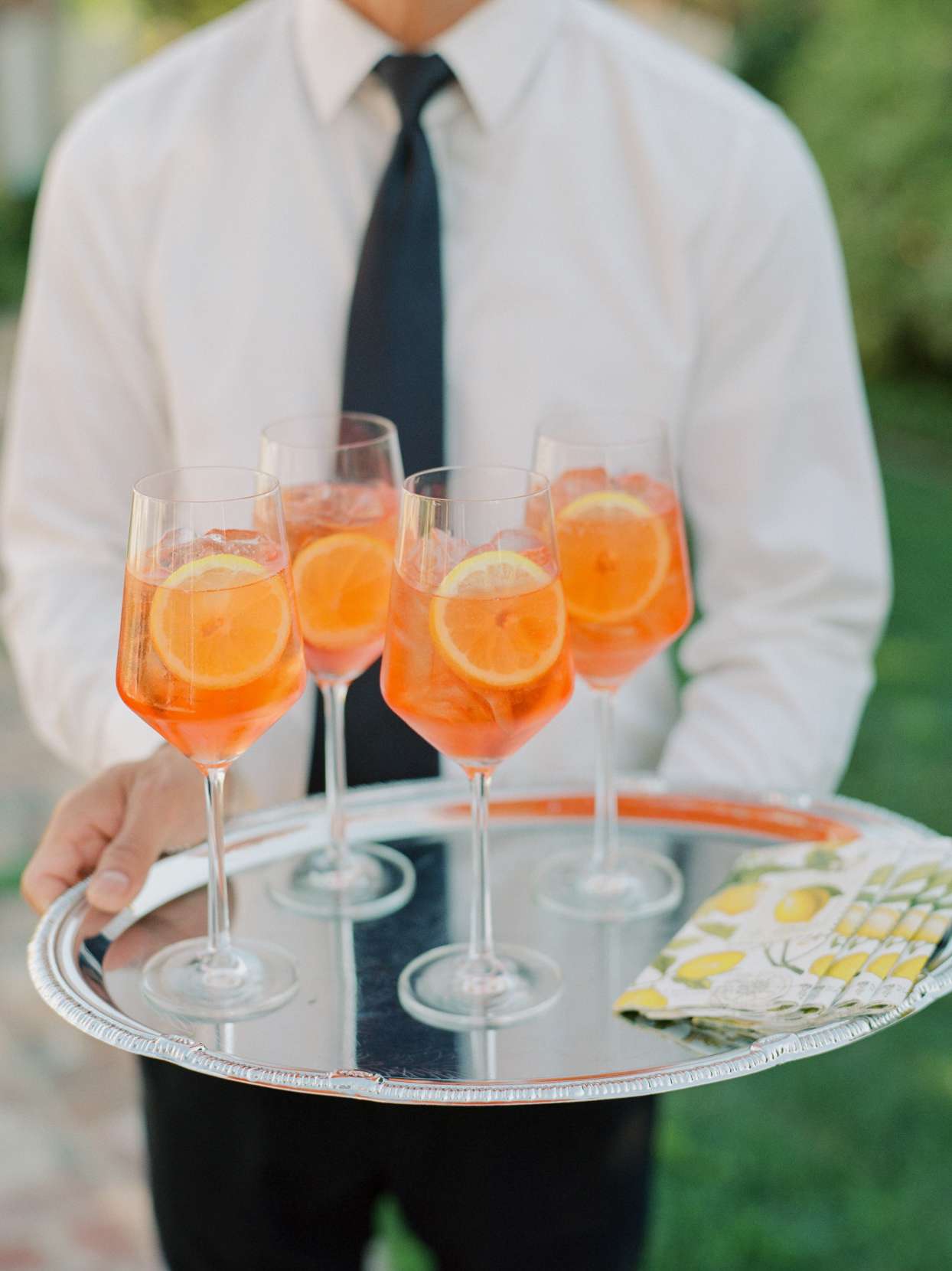 orange welcome cocktails on tray