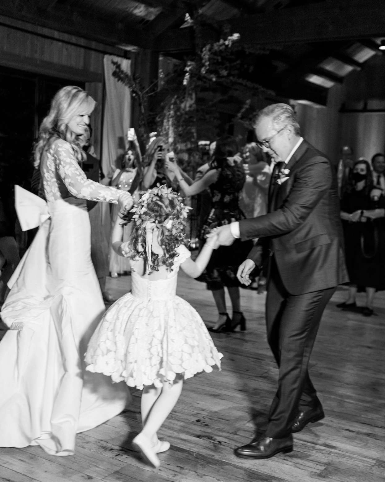 family dancing at wedding reception