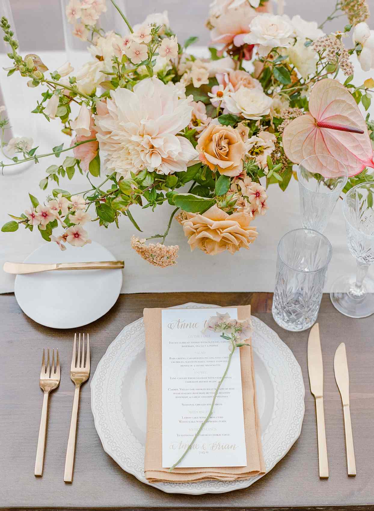 dinner table setting with floral centerpiece