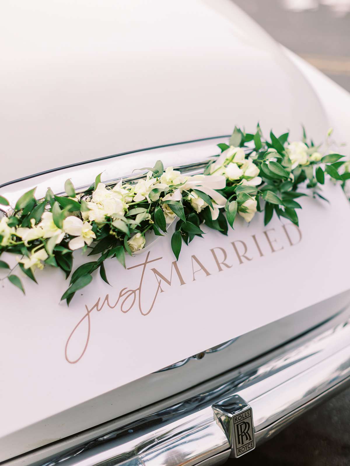 white cary with florals and just married decal
