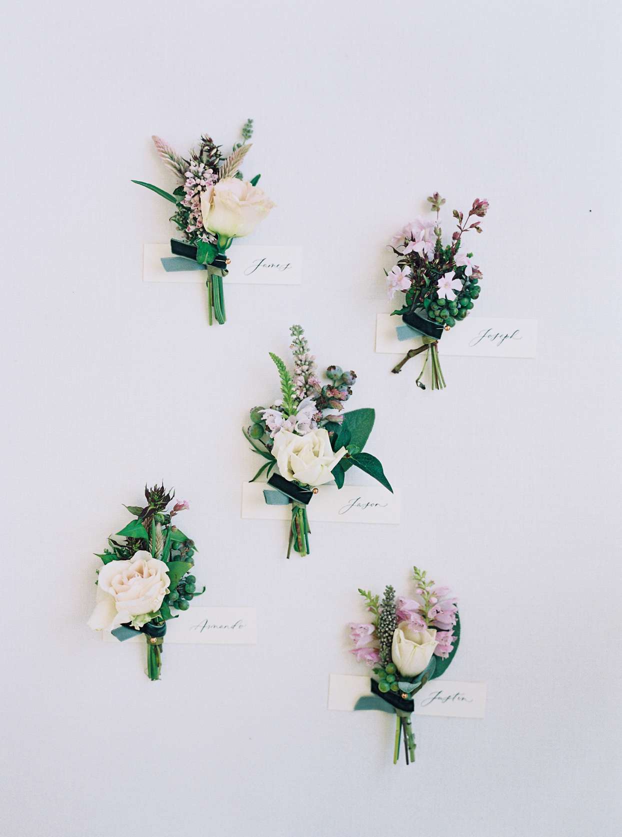 groomsmen boutonnieres with purple accents