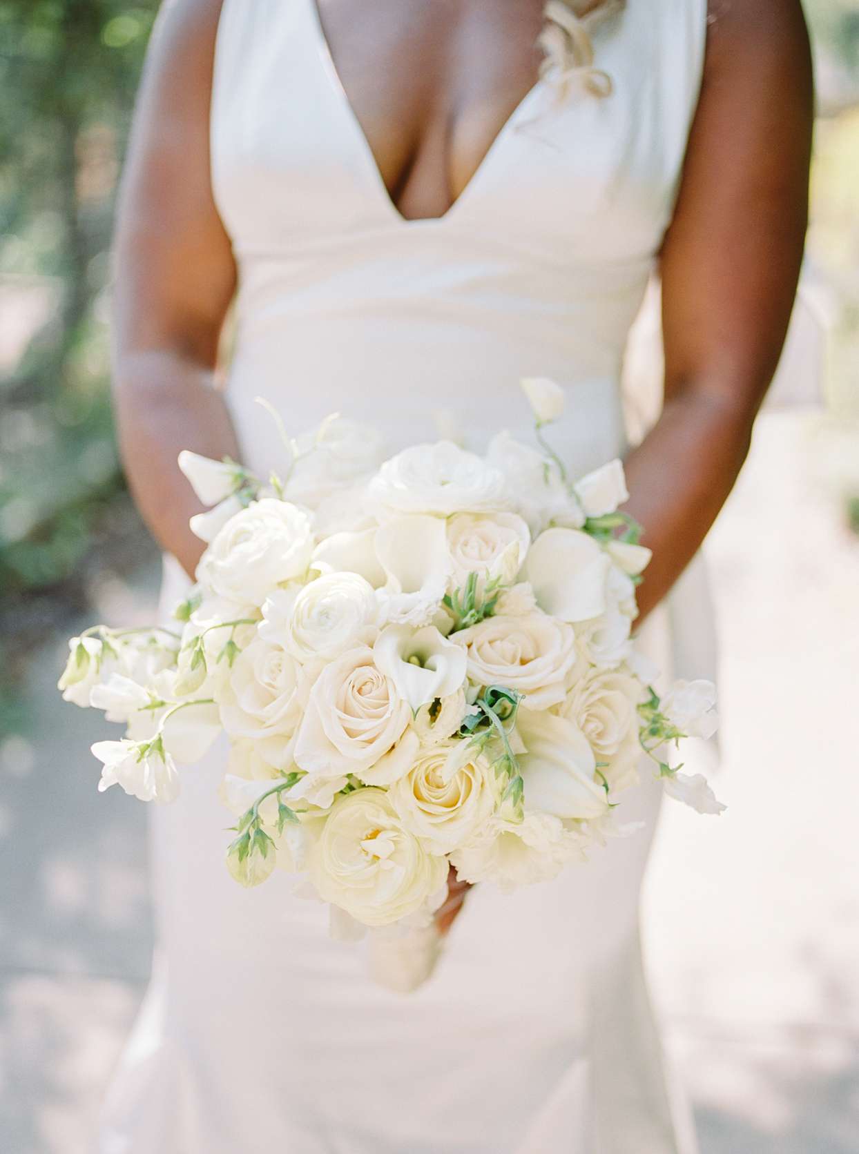 bride holding white bouquet