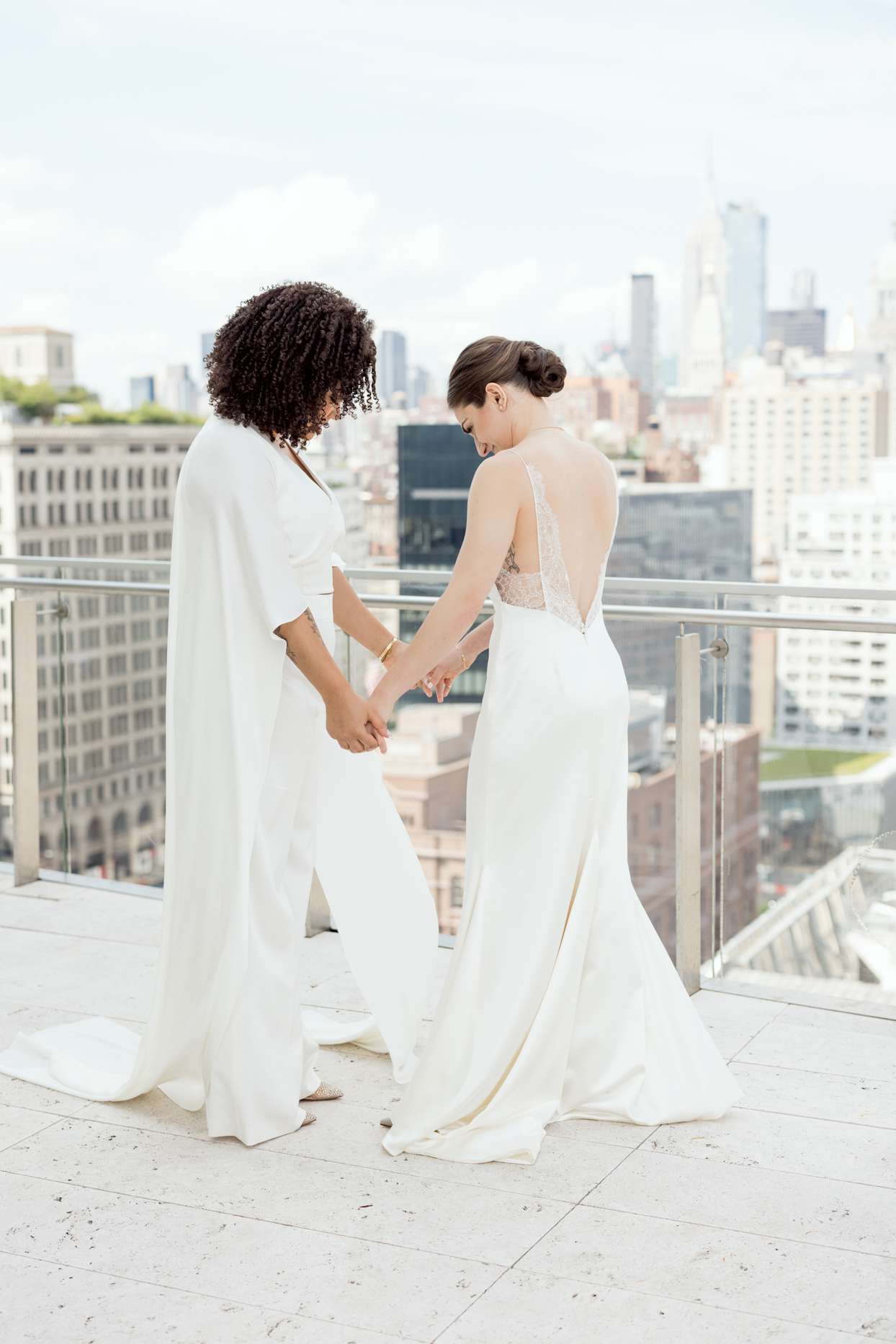 brides sharing first look on new york city rooftop