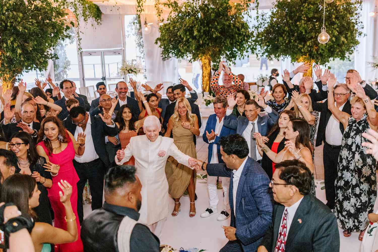 wedding guests dancing at wedding reception