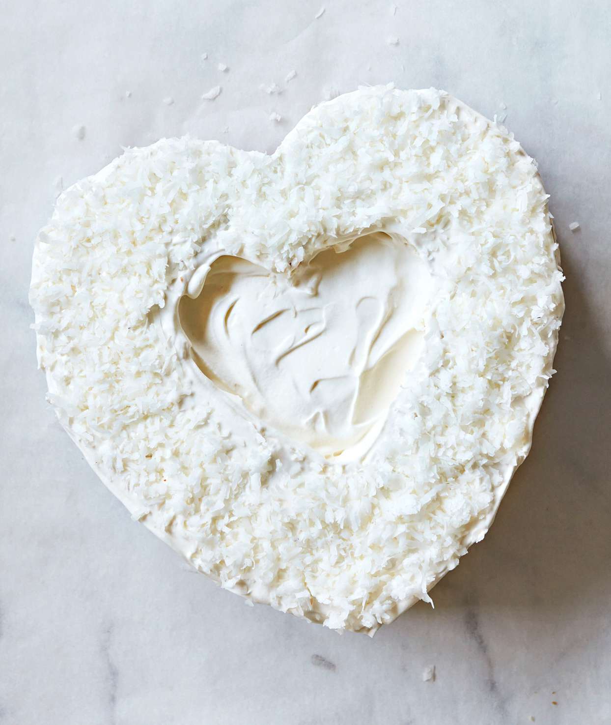 heart shaped cake with coconut flake layer