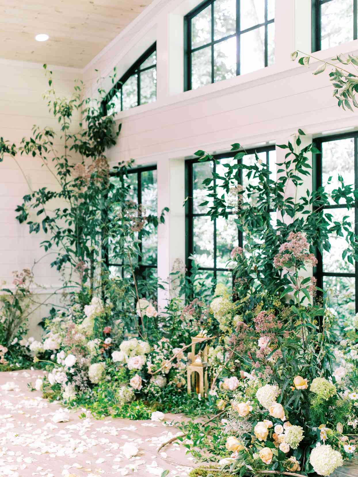 wedding ceremony windows filled with florals