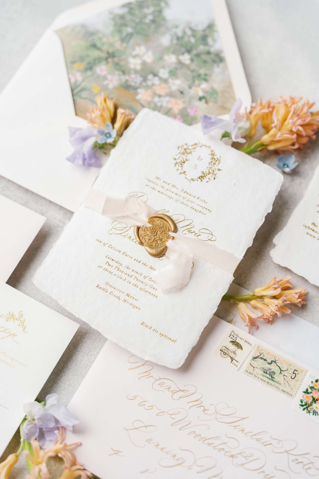 wedding suite with gold seal and colorful flowers