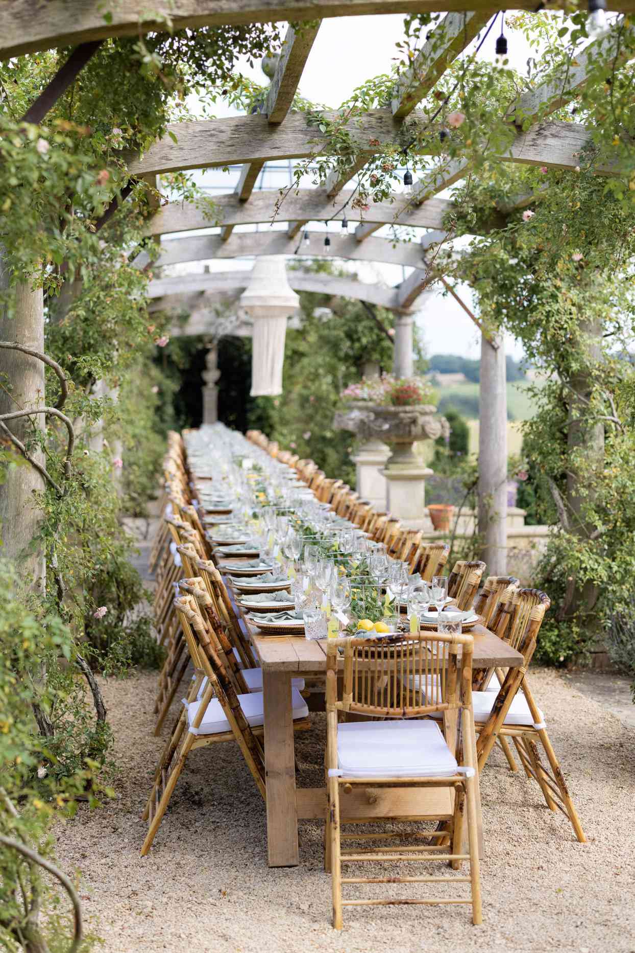 outdoor dinner with long banquet table under gazebo