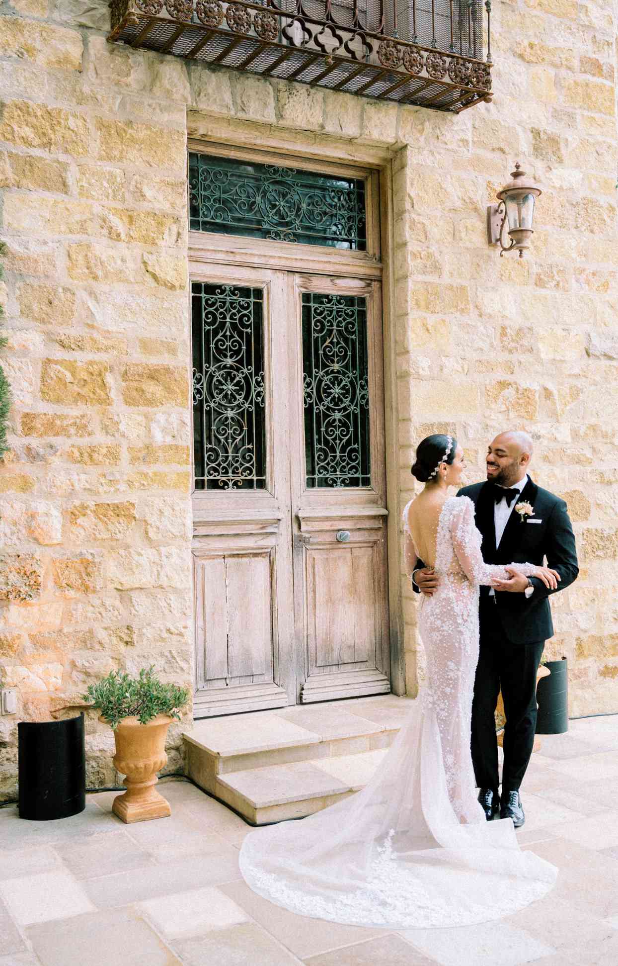 wedding couple first look portrait in front of villa doors