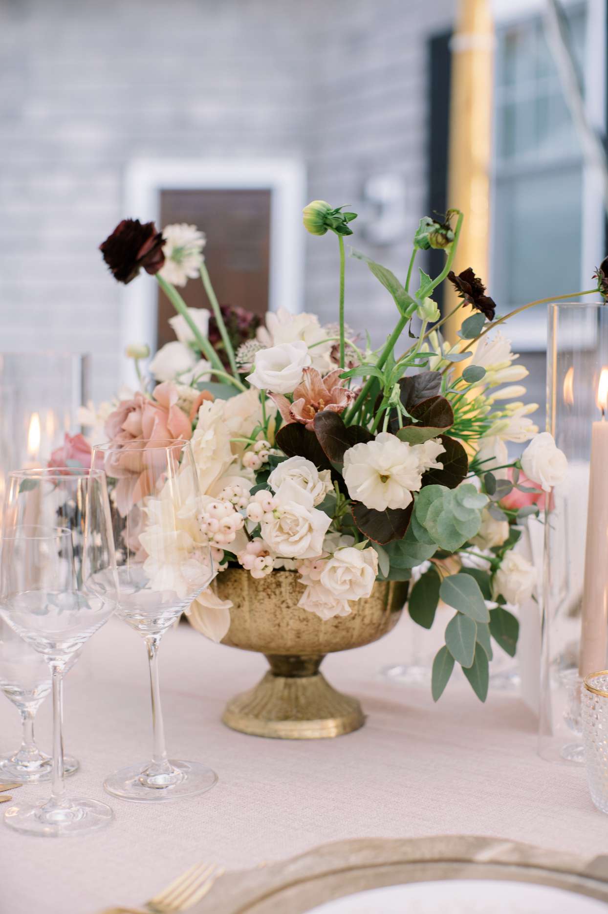 pink and cream floral centerpiece with gold vase