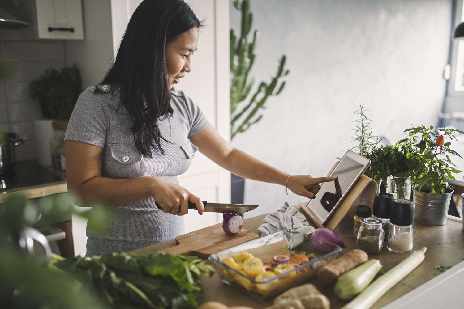 woman preparing healthy meal in kitchen
