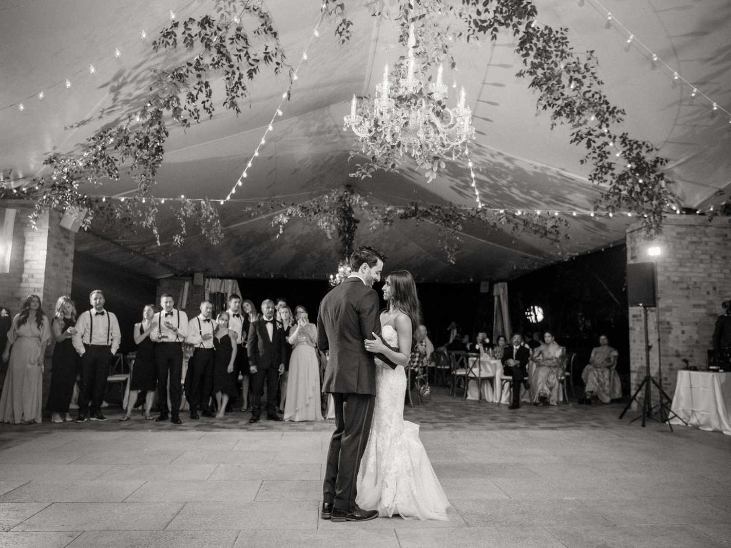 wedding first dance under chandelier
