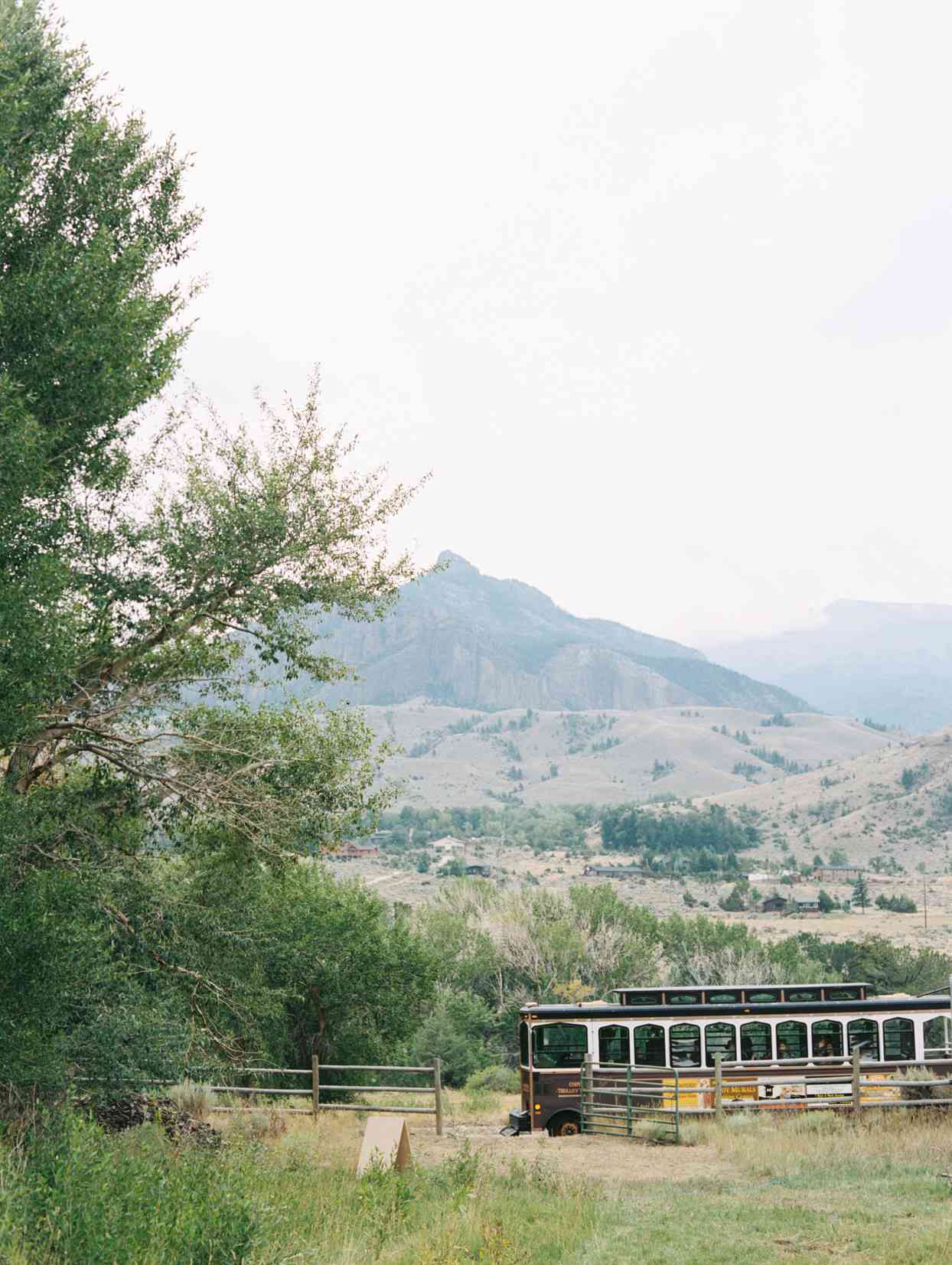 wedding trolly for guests driving on gravel road
