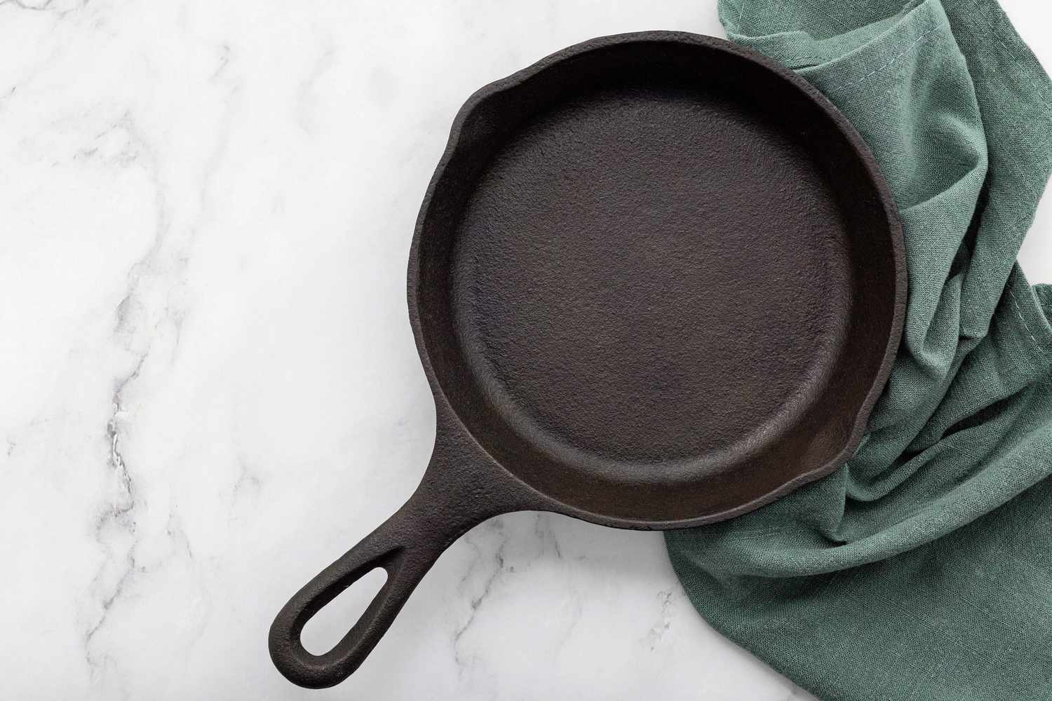 cast iron skillet on marble surface