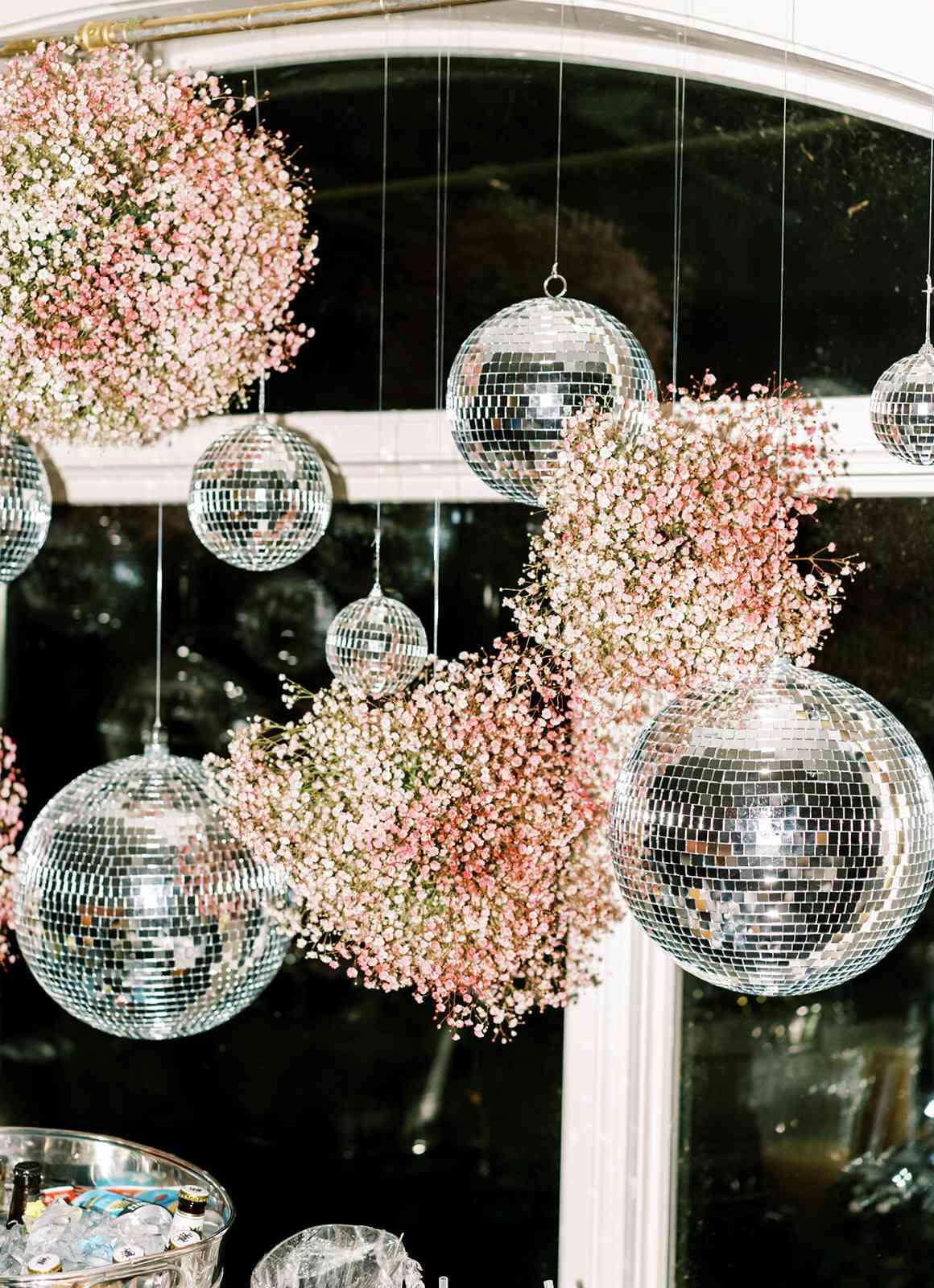 disco balls and floral arrangements hanging from ceiling