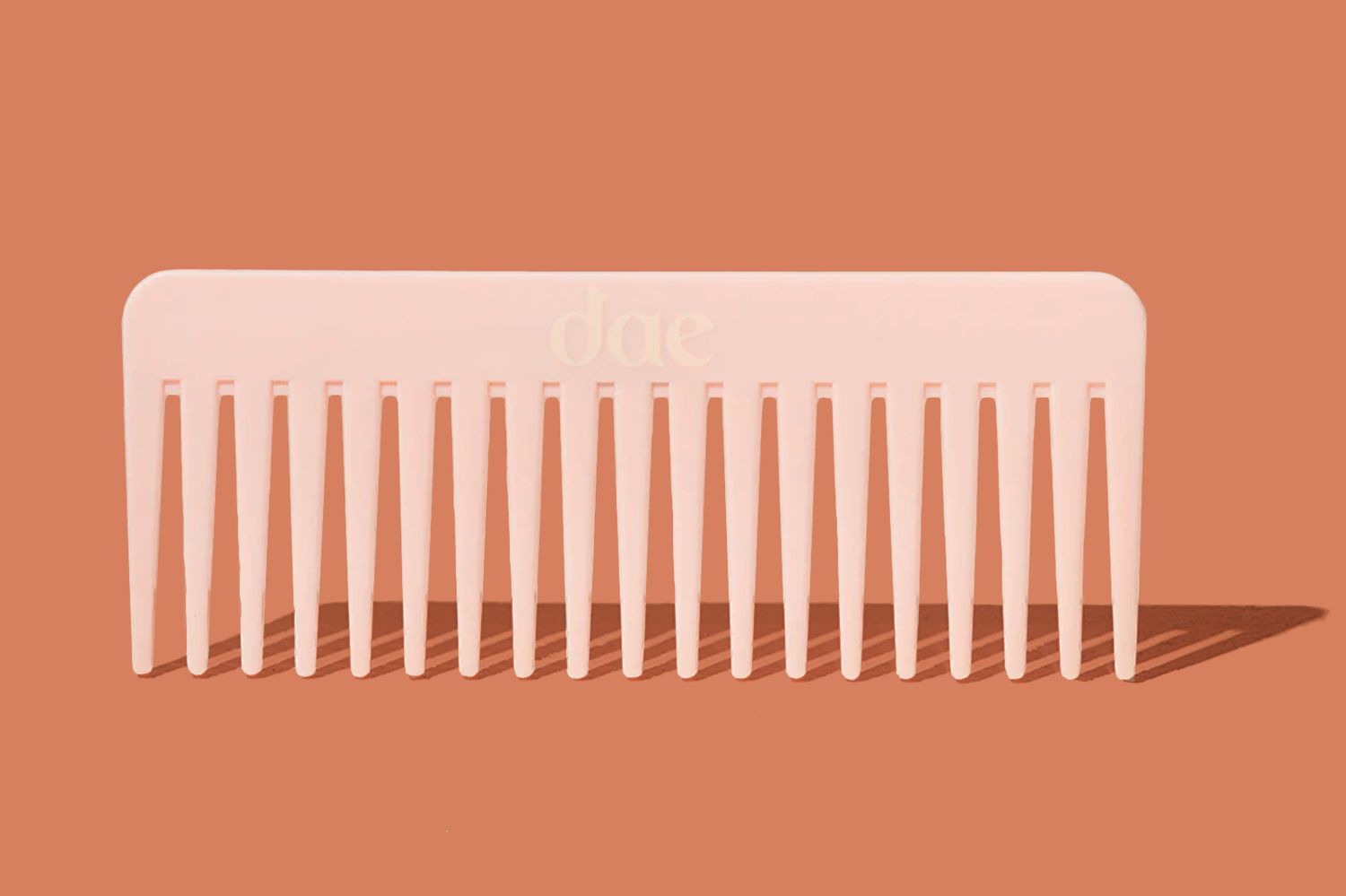 Wide tooth comb on solid background
