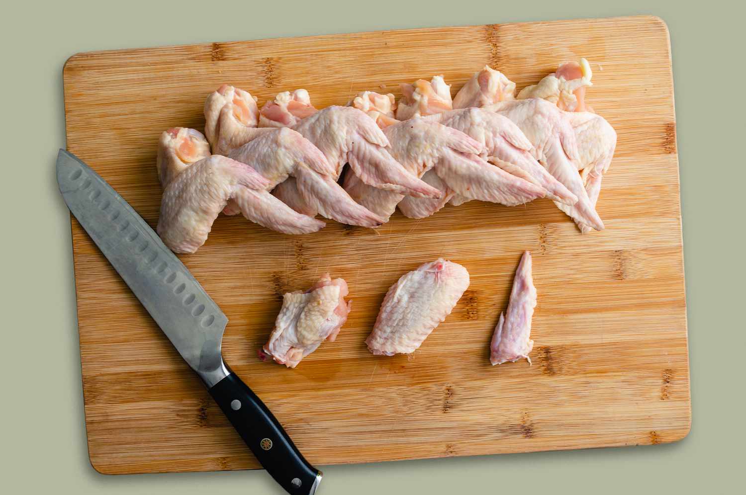 Raw chicken wings on cutting board