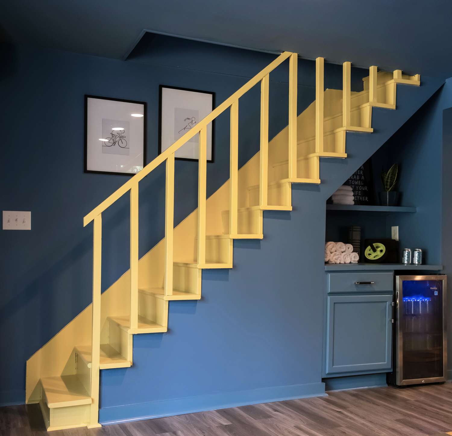inky blue basement with yellow stairs