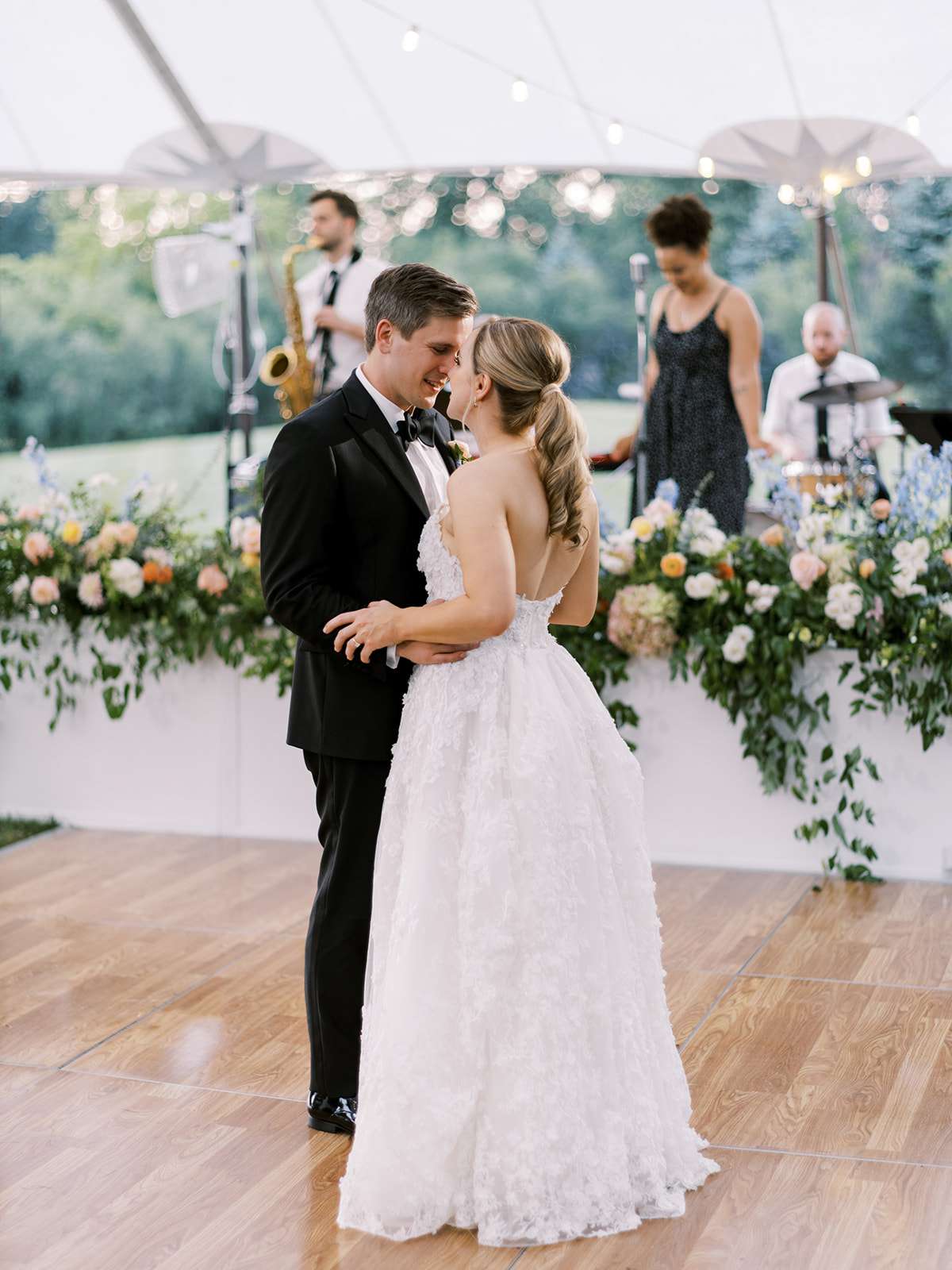 bride and groom share face to face moment during first dance
