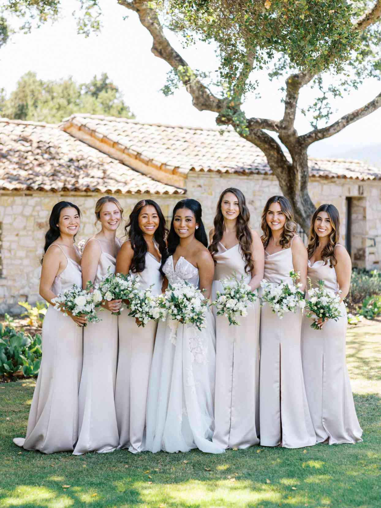 bride with bridesmaids in champagne slip dresses from Amsale paired with nude shoes