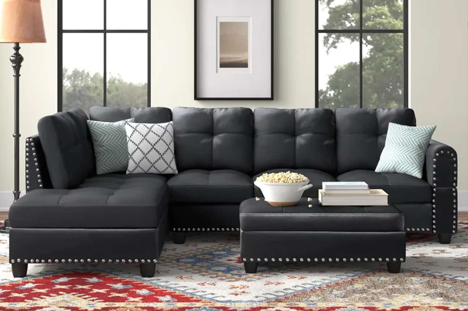 black storage couch with metal studs