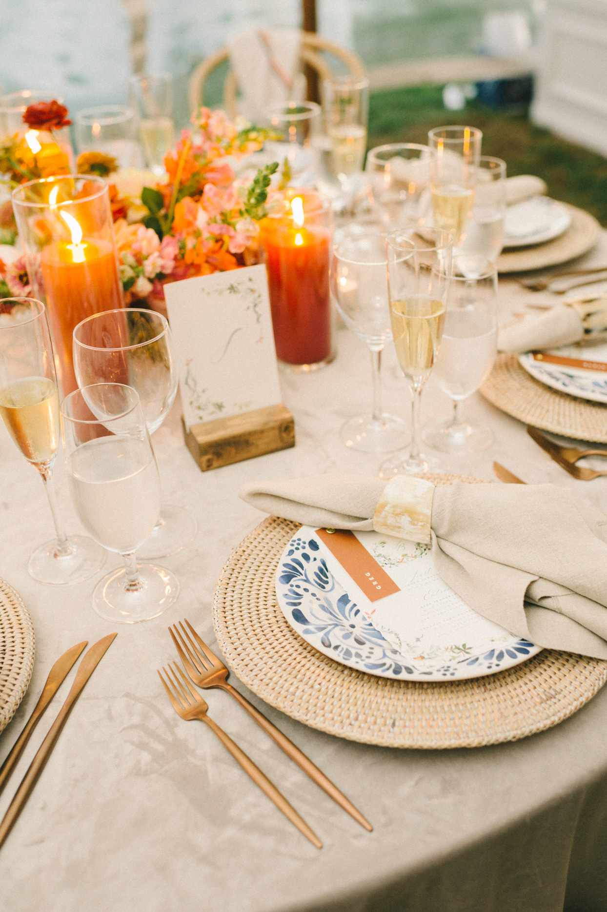 warm toned neutrals with orange and blue accent table settings