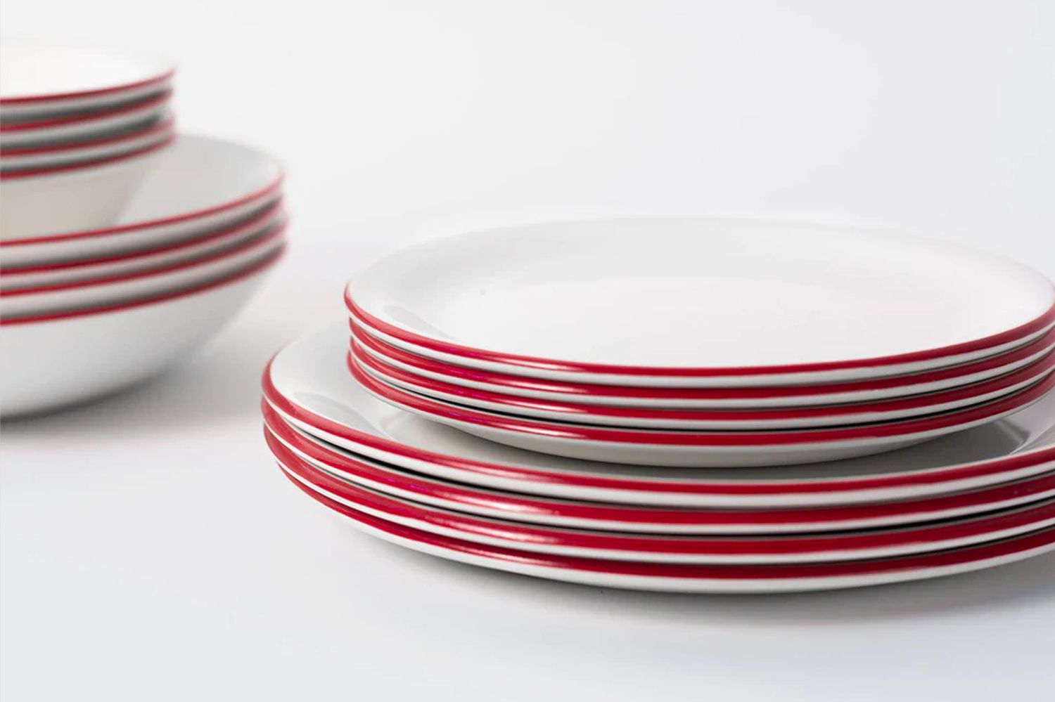 white dishes with red rim