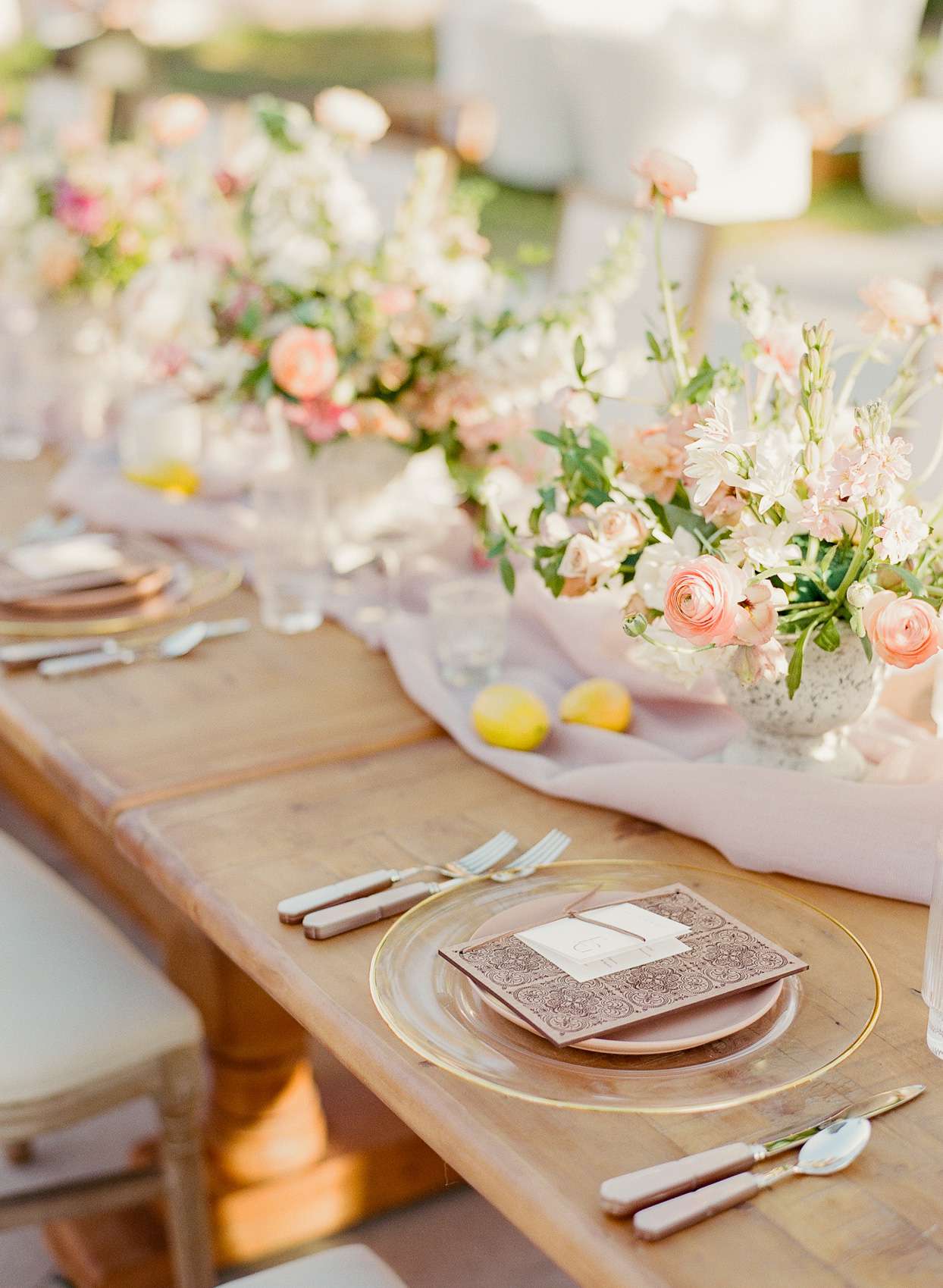 pink floral arrangements and lemons centerpiece table decor