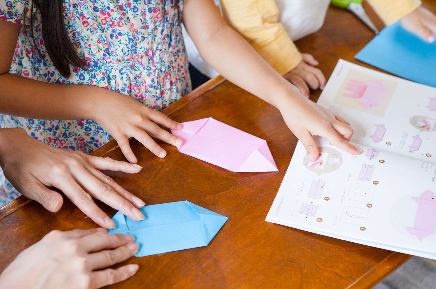 kids making a paper craft