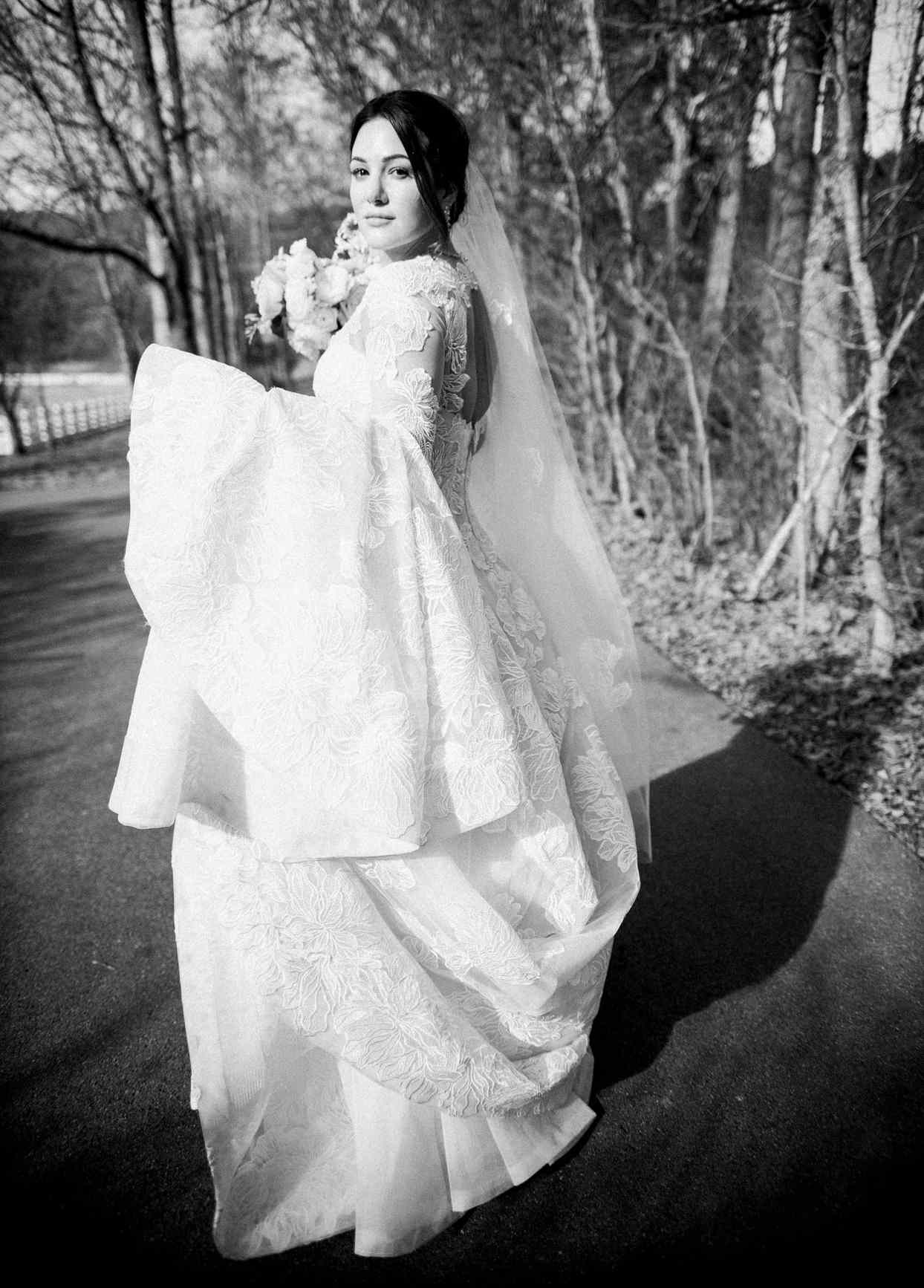 bride wearing lace long sleeve wedding dress