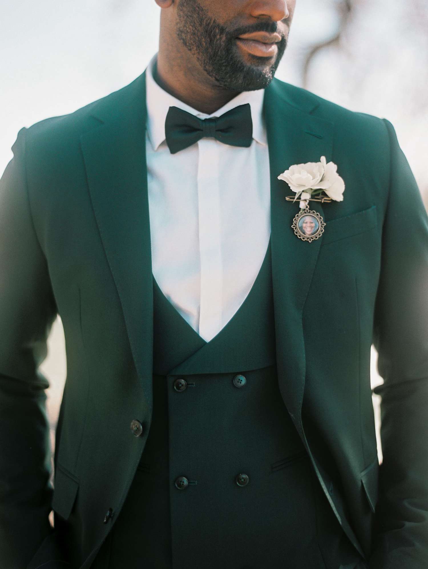 groom in green suit