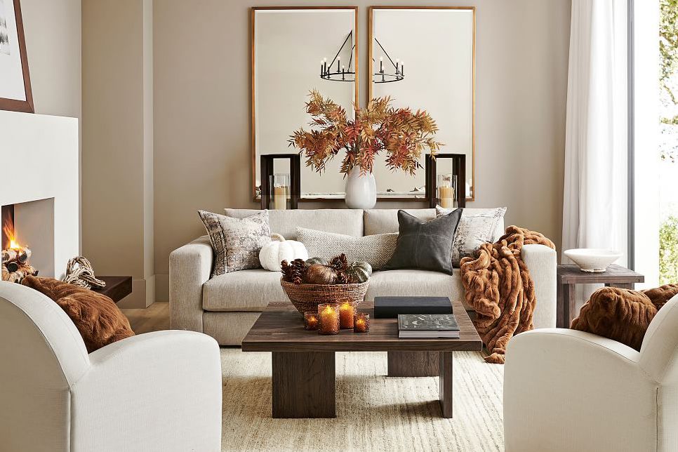 cozy living room with pumpkin pillows for fall