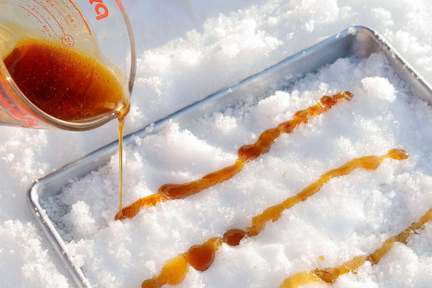 <p>On a winter day, you can't do better than this creative treat. To make it, you boil and then pour maple syrup into rows on a snow-lined tray. Roll the frozen syrup into sticks and you've got a chewy, irresistible candy. </p>
                          