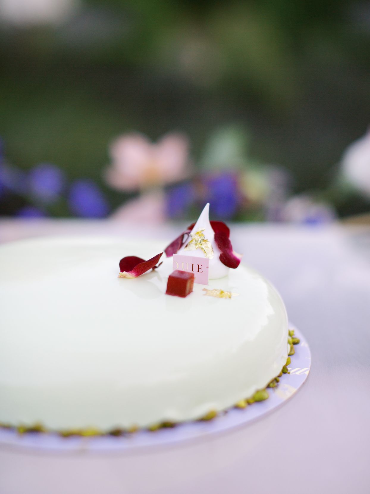 pistachio joconde cake with almond mousse, pistachio mousse, and cherry marmalade for wedding reception