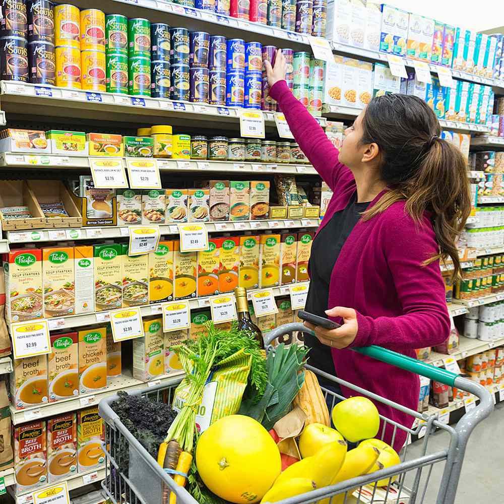 woman-shopping-fresh-canned-fruit.jpg