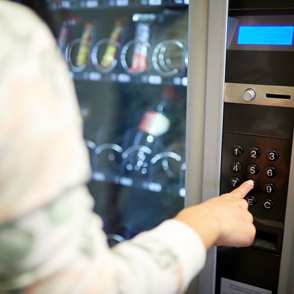 woman using a vending machine