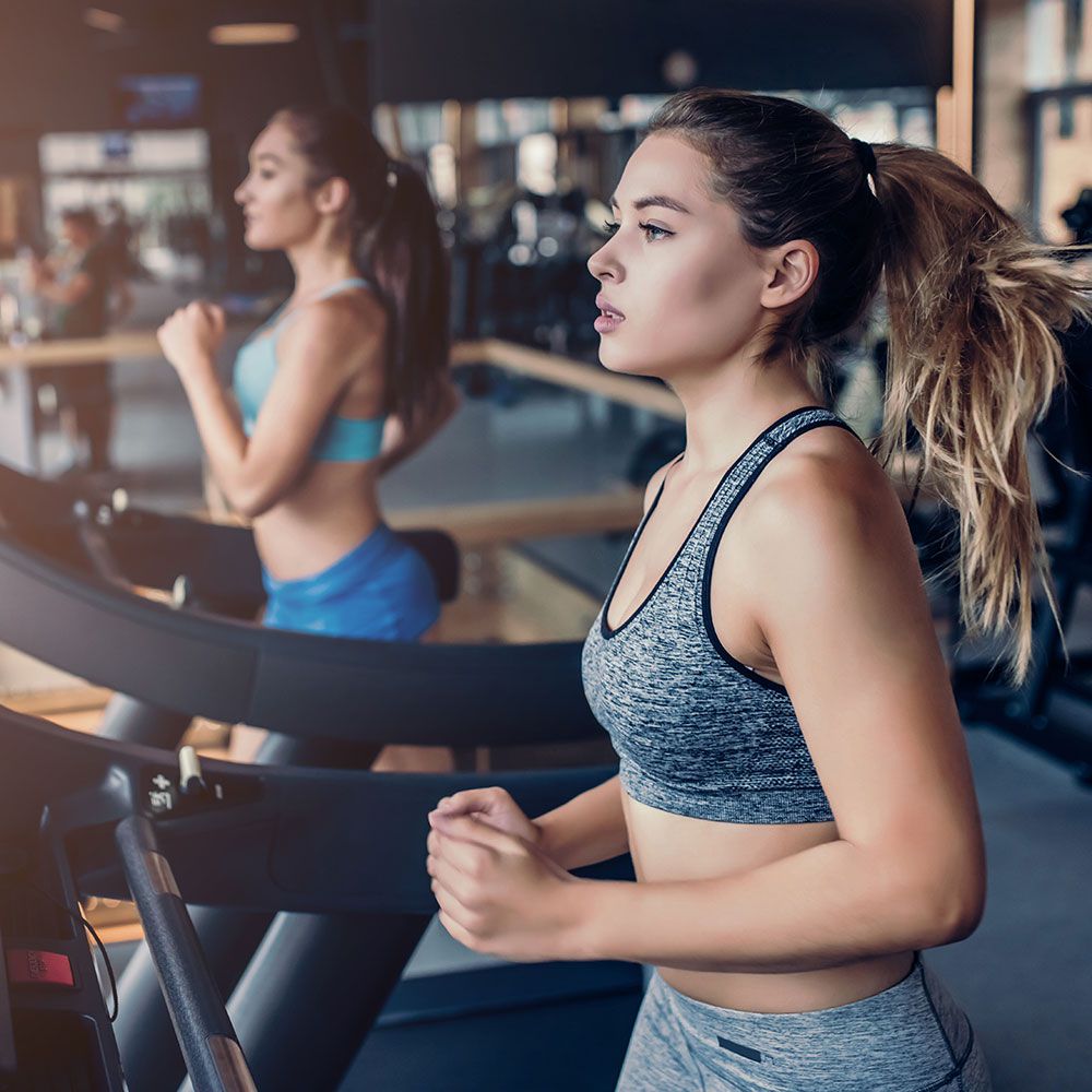 woman on treadmill doing cardio workout
