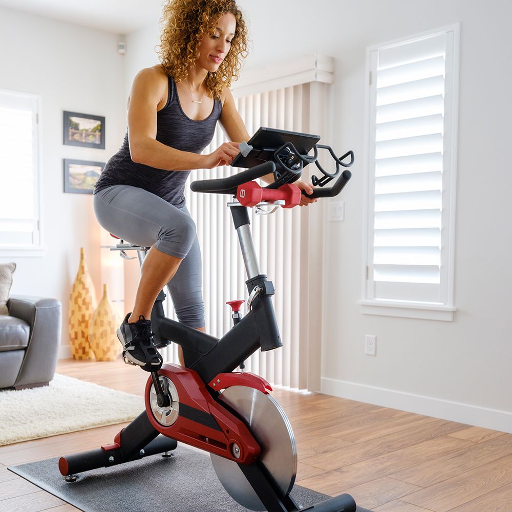 woman checking rpm in spin class
