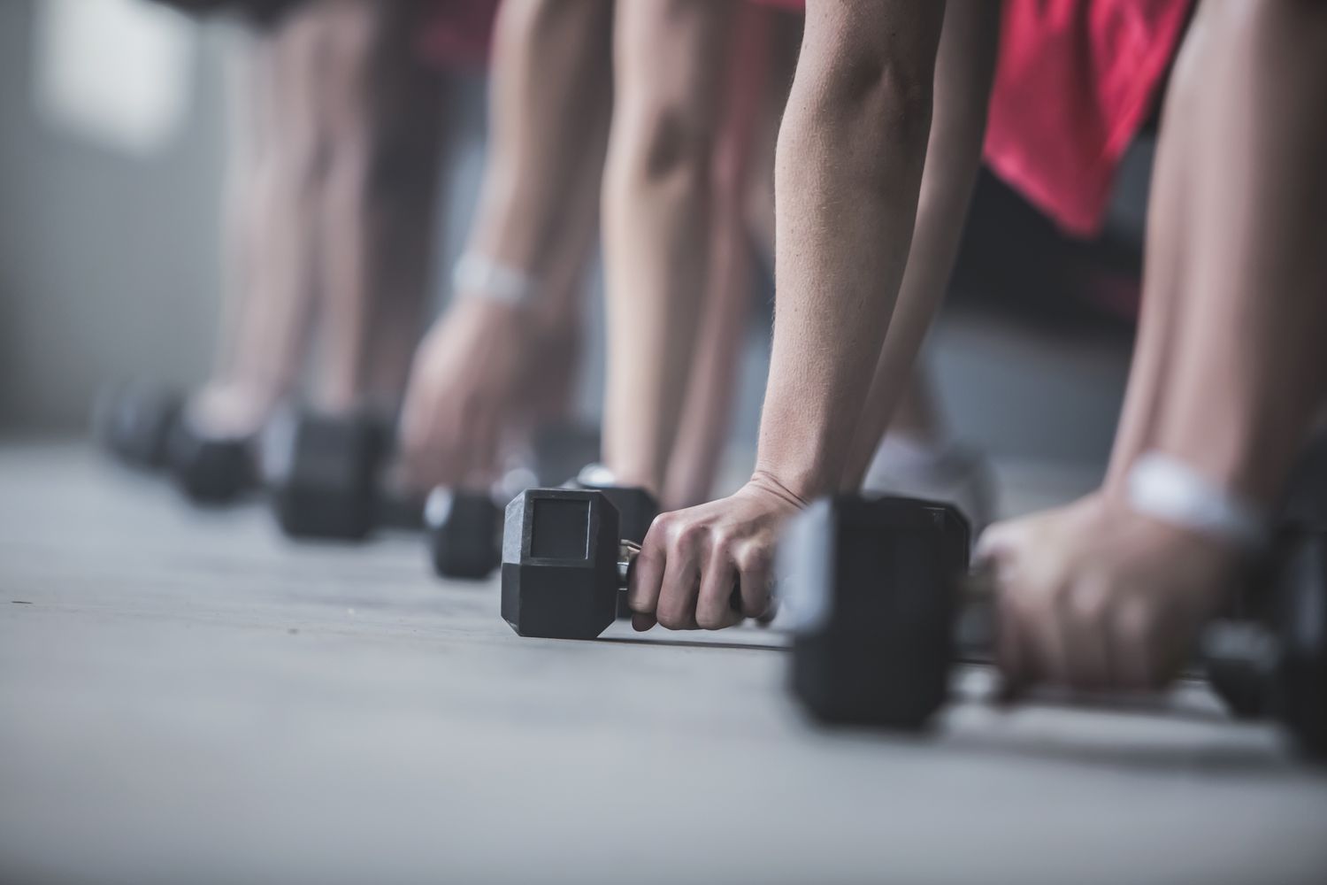 Athletes doing push-ups and lifting weights on floor causing carpal tunnel