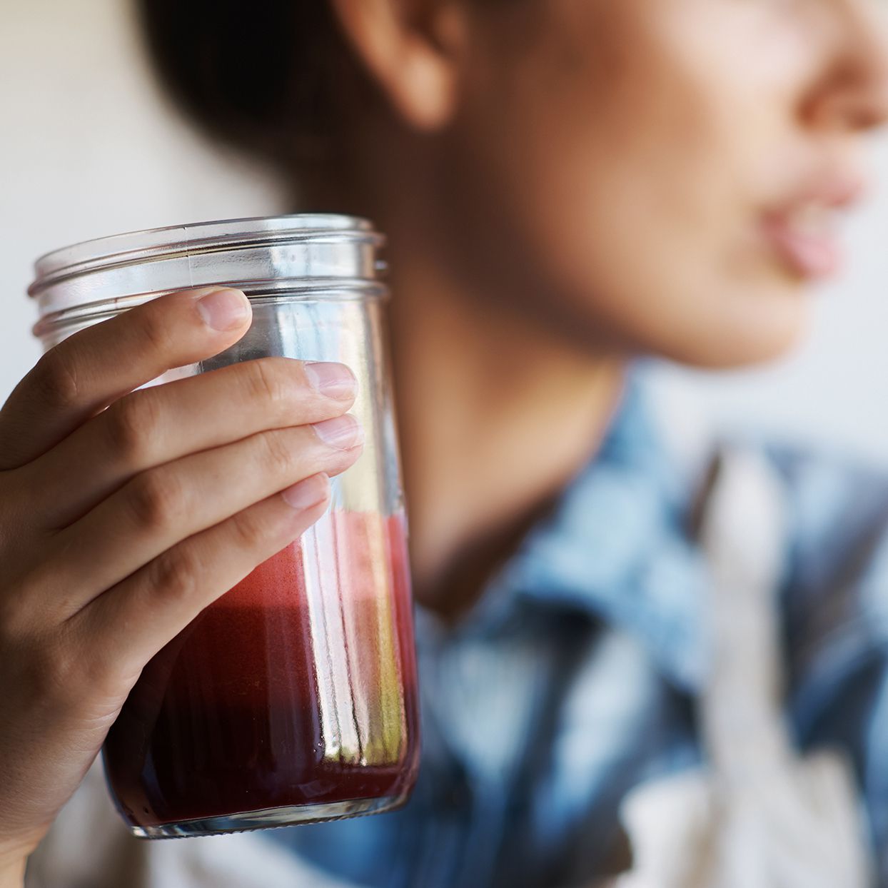 Woman drinking beet juice