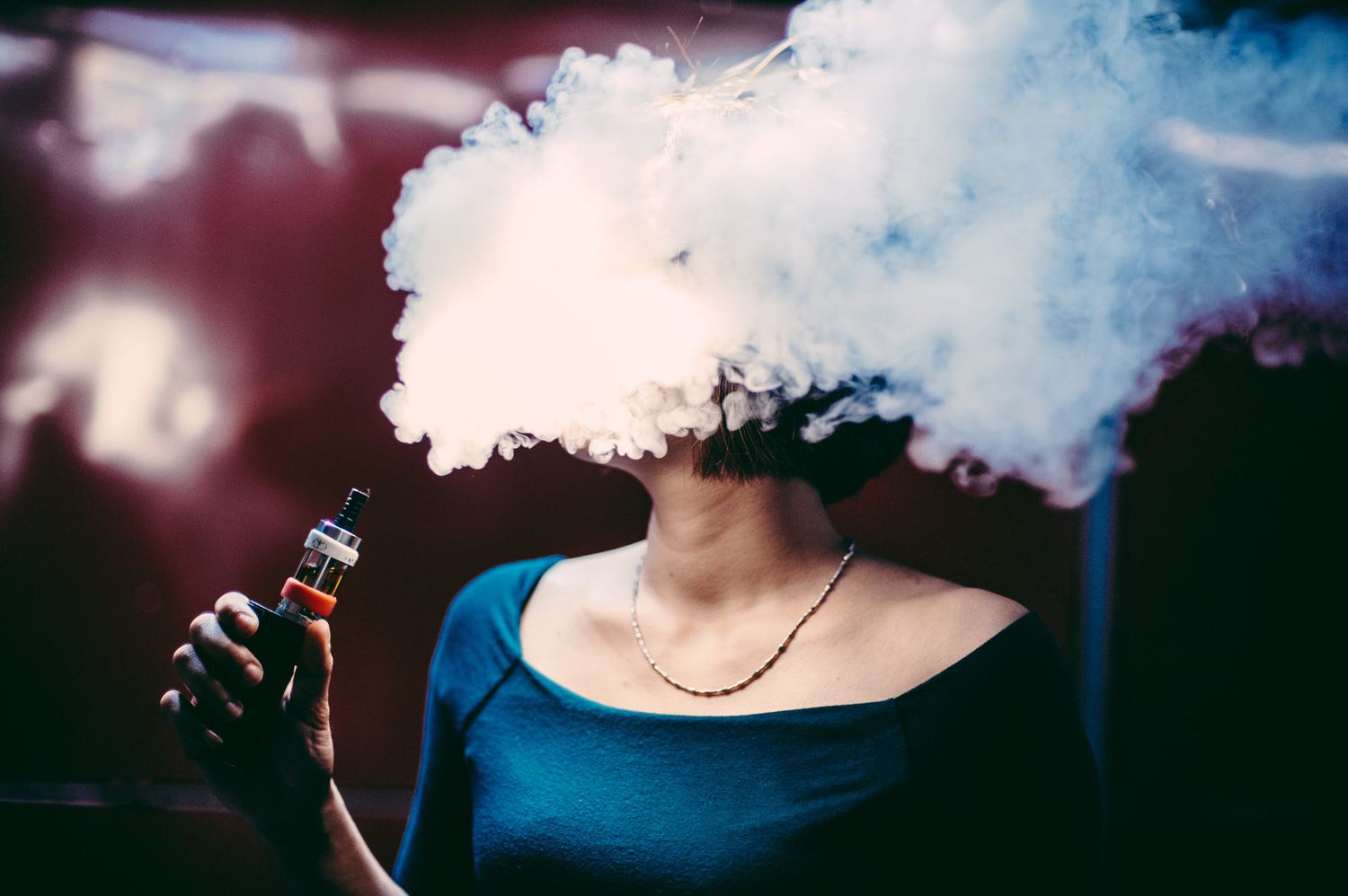 woman-vaping-dangers-of-e-cigarettes-juul