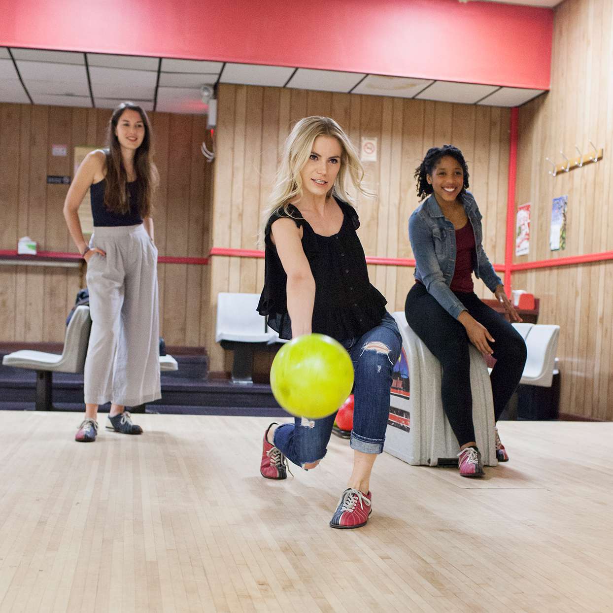 Three women bowling