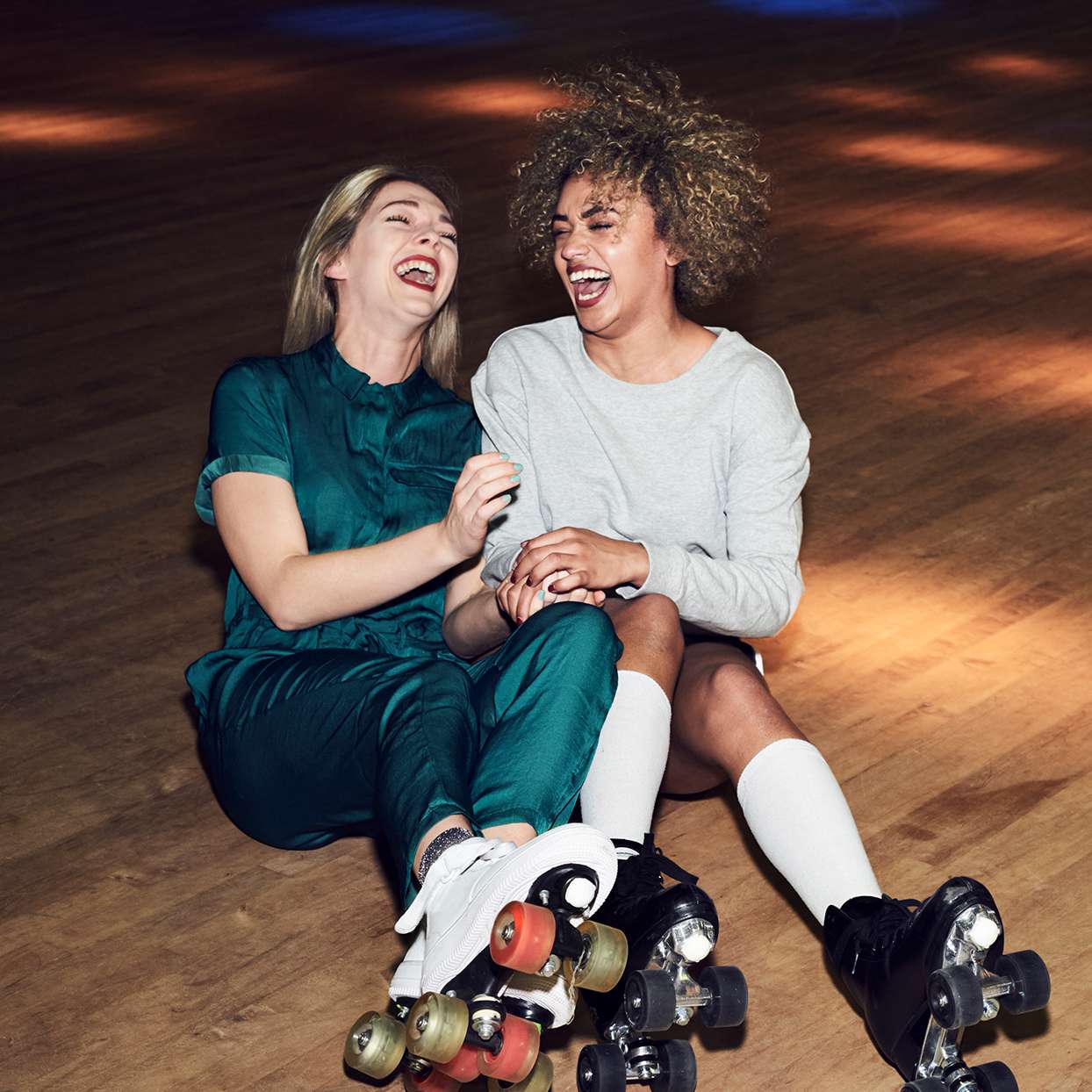 Two women roller skating