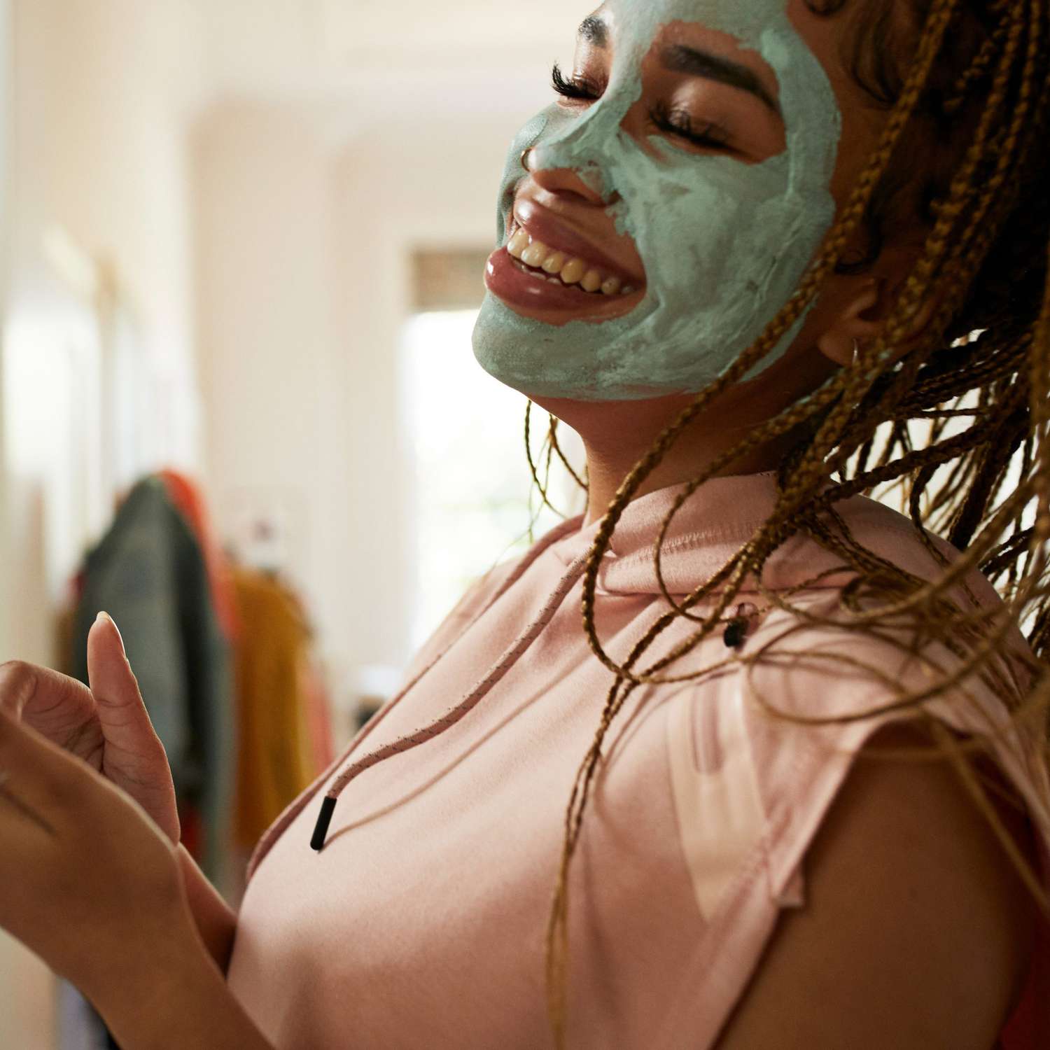 Woman_Laughing_While_Wearing_Face_Mask_for_Skin