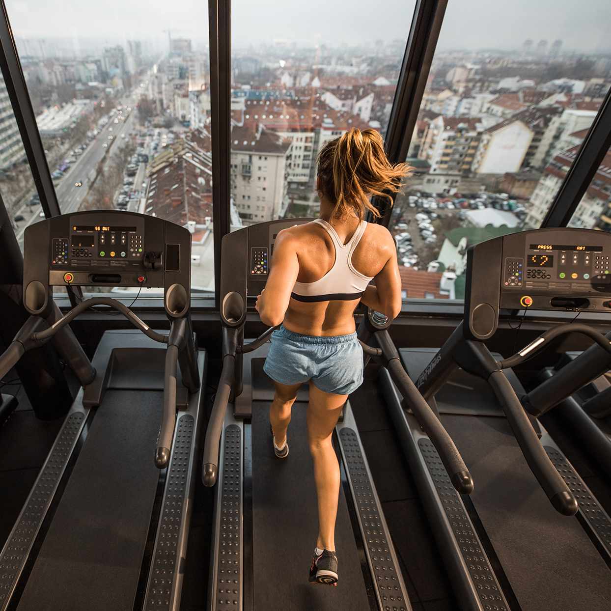 Woman doing a treadmill sprint workout