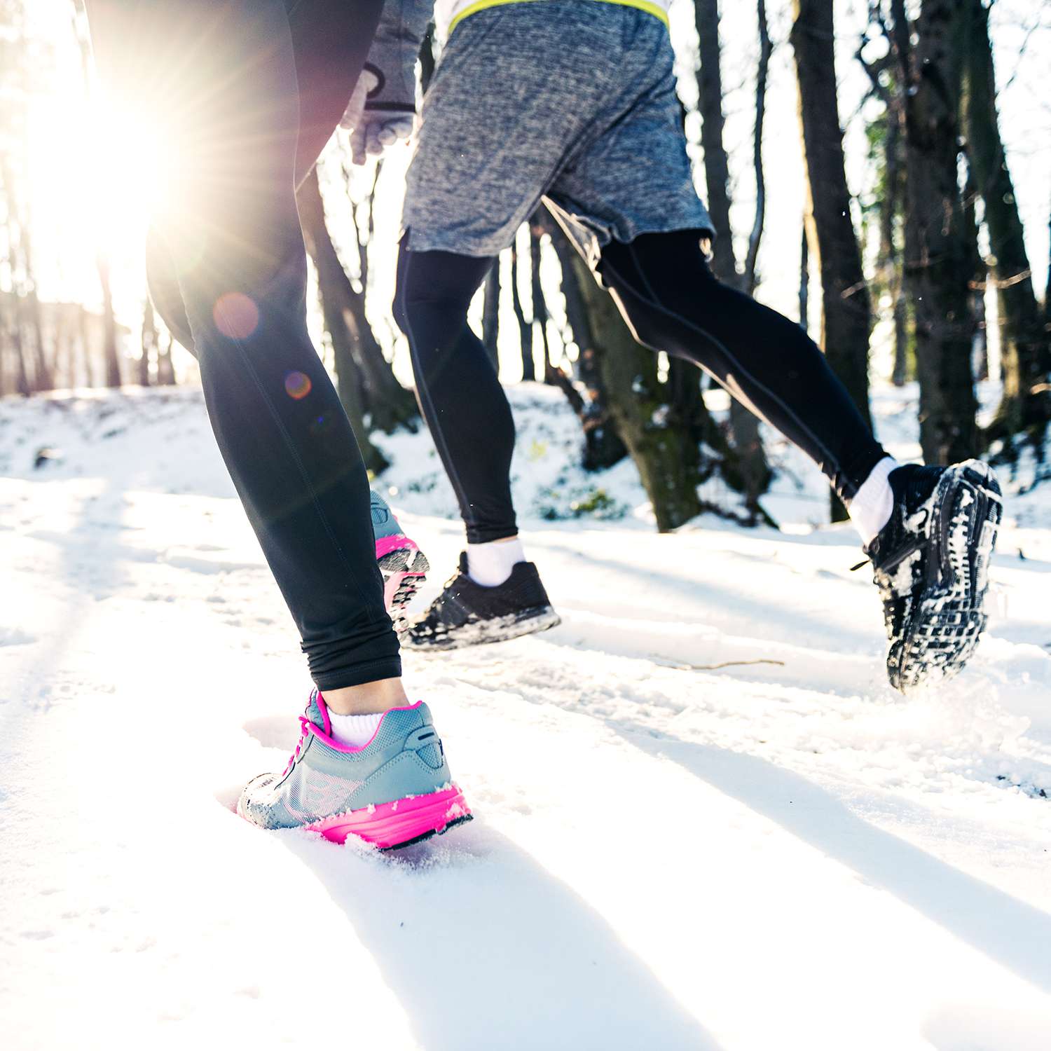Running on snowy trail with winter running shoes