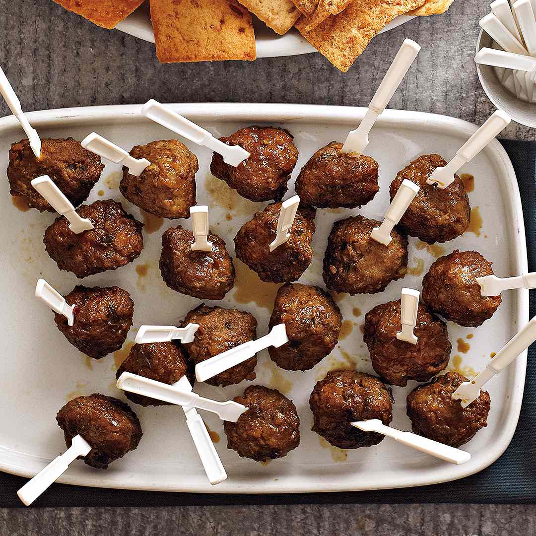 Molasses-Lime Meatballs recipe with stickers on white pan